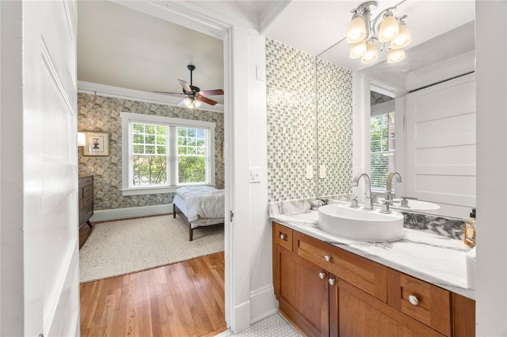 266 11th Street Northeast, Unit 203 Atlanta, GA 30309 - Photo 21 of 50 a spacious bathroom with a double vanity sink a large mirror and a bathtub