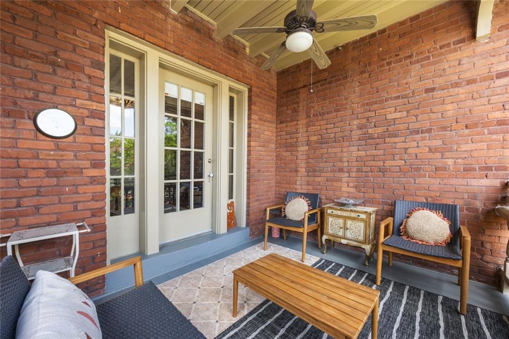 266 11th Street Northeast, Unit 203 Atlanta, GA 30309 - Photo 29 of 50 a living room with furniture a rug and a fireplace