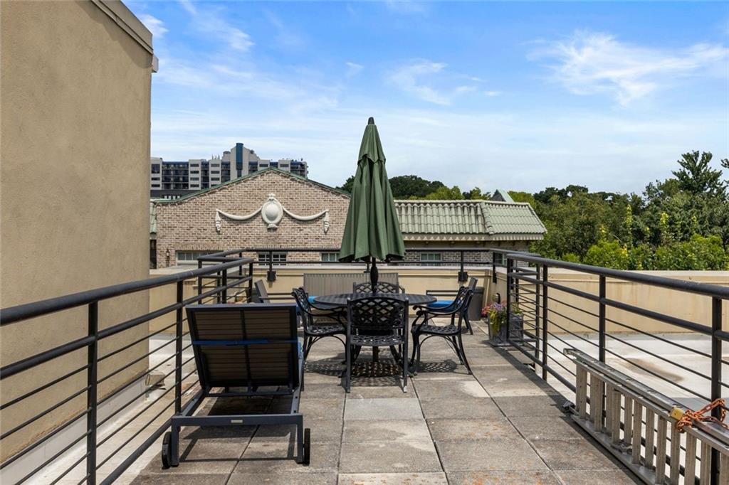 266 11th Street Northeast, Unit 203 Atlanta, GA 30309 - Photo 42 of 50 a view of a chairs and table in patio