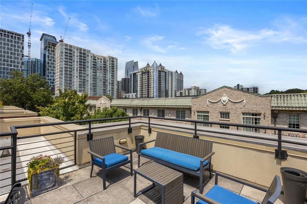 266 11th Street Northeast, Unit 203 Atlanta, GA 30309 - Photo 43 of 50 a view of a city with tall buildings