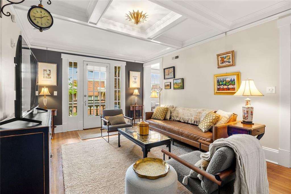 266 11th Street Northeast, Unit 203 Atlanta, GA 30309 - Photo 6 of 50 a living room with furniture a rug and a window