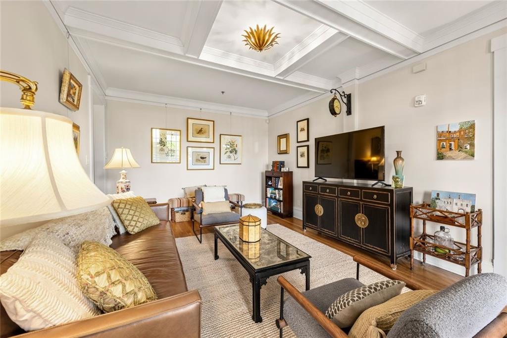 266 11th Street Northeast, Unit 203 Atlanta, GA 30309 - Photo 10 of 50 a living room with furniture and a flat screen tv