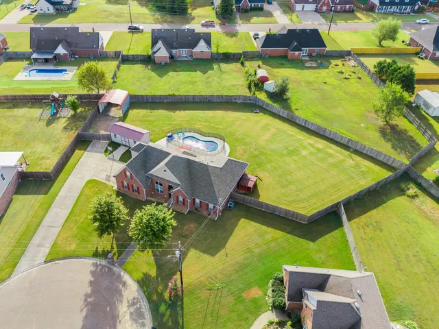 an aerial view of a pool patio swimming pool and outdoor seating
