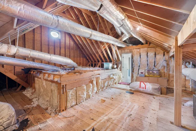 a view of a patio with a table and chairs