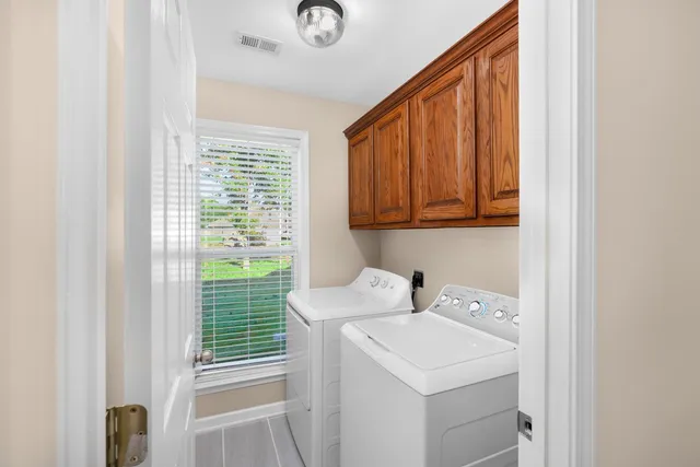 a utility room with a sink washer and dryer