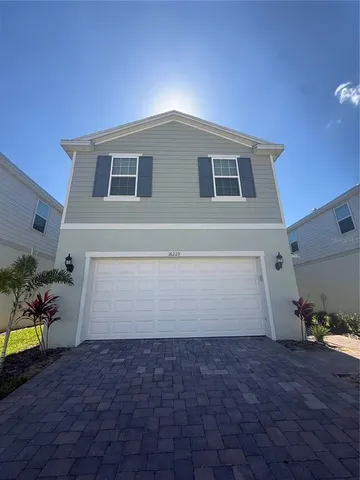 a house view with a backyard space