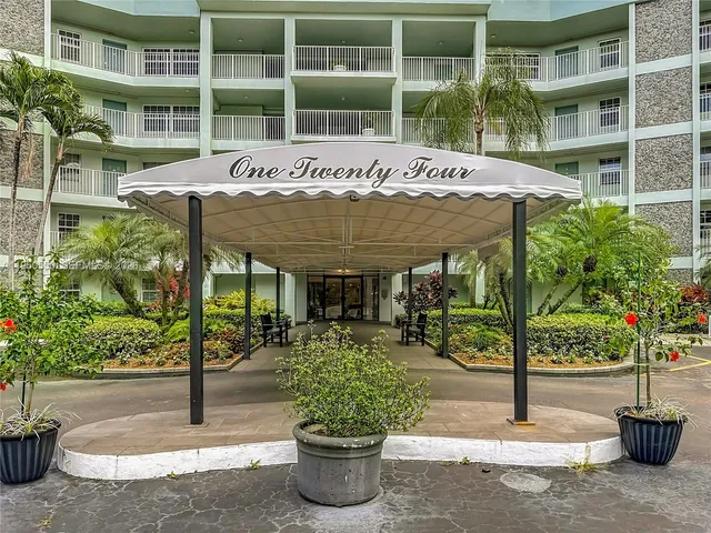 a front view of a building with garden