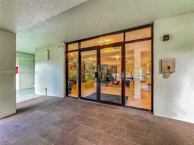 a living room with furniture window and a flat screen tv