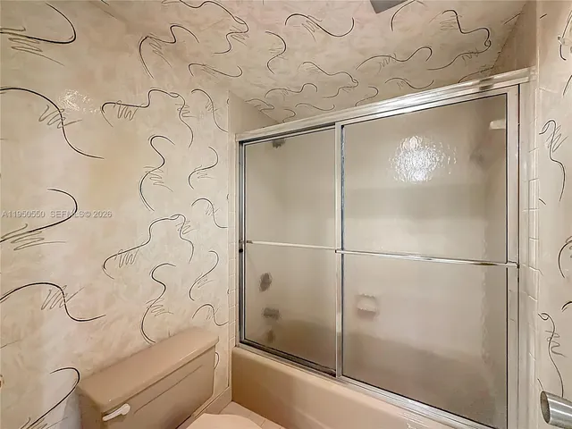 a view of storage and utility room with washer and dryer