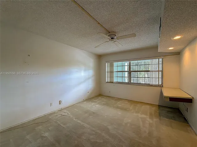 a view of a room with air conditioner and a living room view