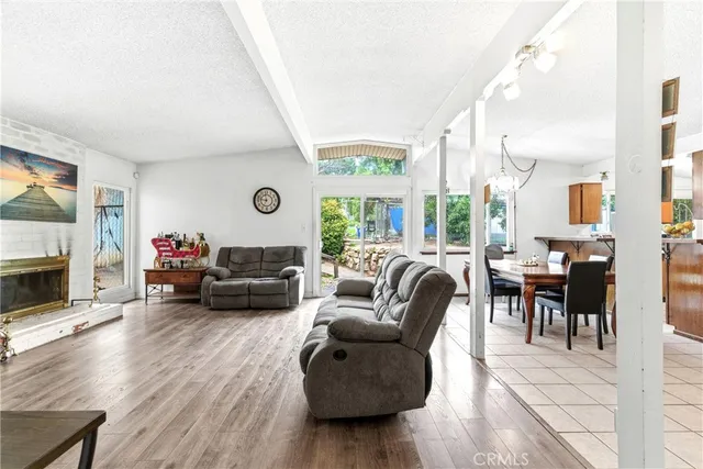 a living room with furniture fireplace and a flat screen tv