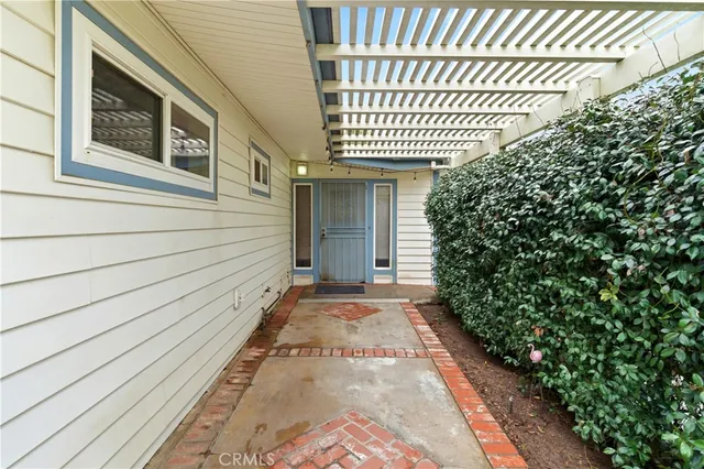 a view of a house with a door and wooden floor