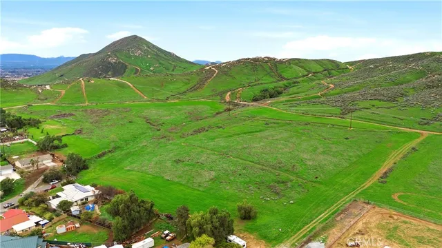 a view of a field with an ocean