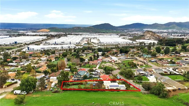 a view of a lush green hillside and a houses