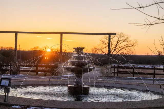 a view of a balcony with chairs and wooden floor