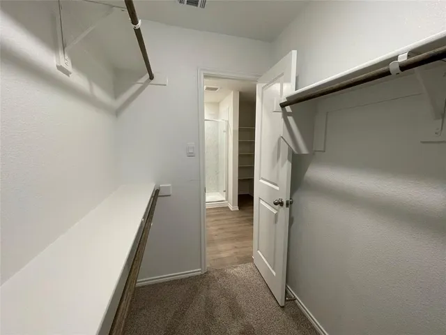 a bathroom with a double vanity sink toilet and mirror