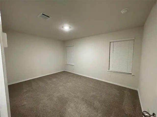 a living room with stainless steel appliances kitchen island granite countertop a sink cabinets and wooden floor
