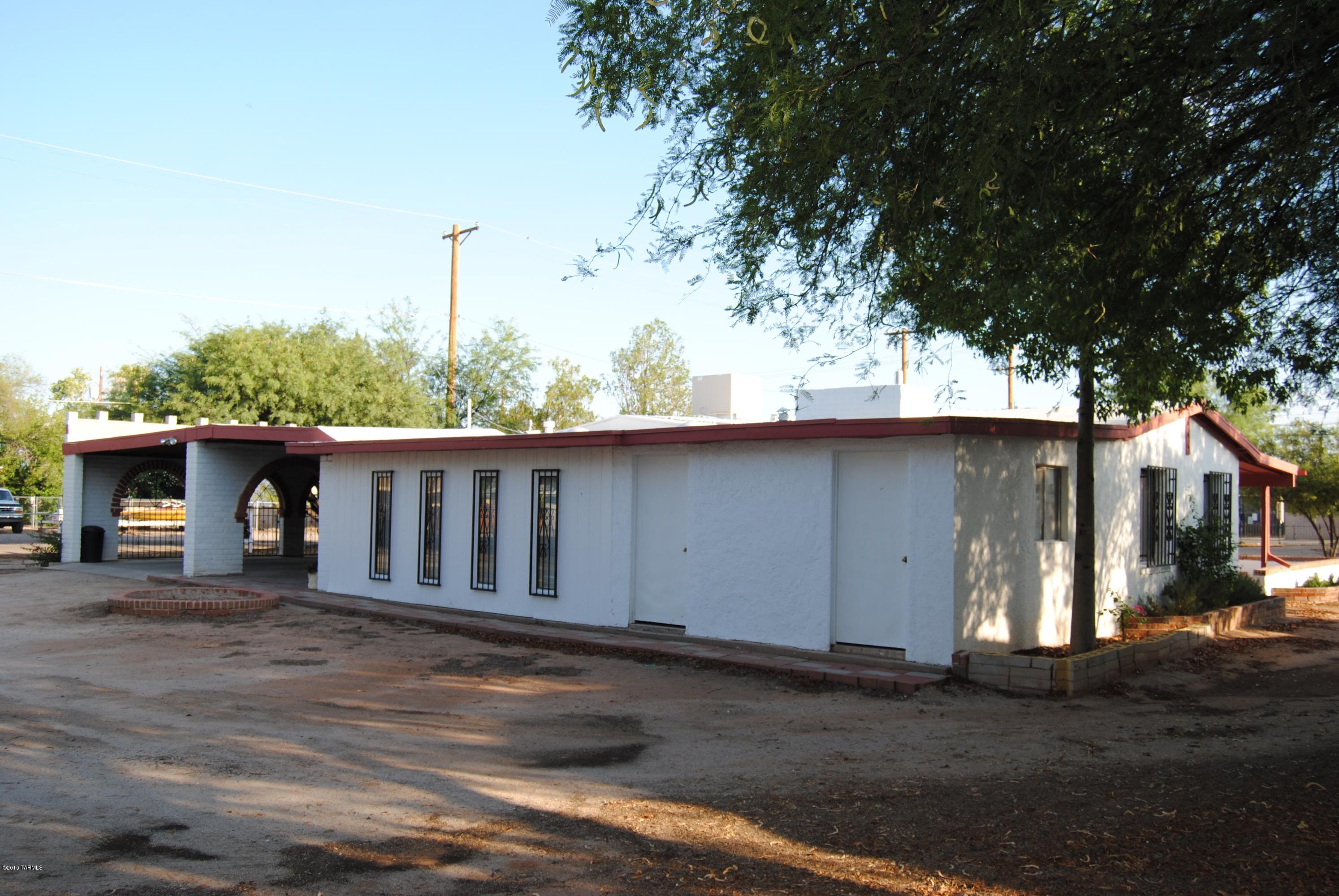 1607 West Roger Road Tucson, AZ 85705 - Photo 14 of 14 a view of a house with a yard