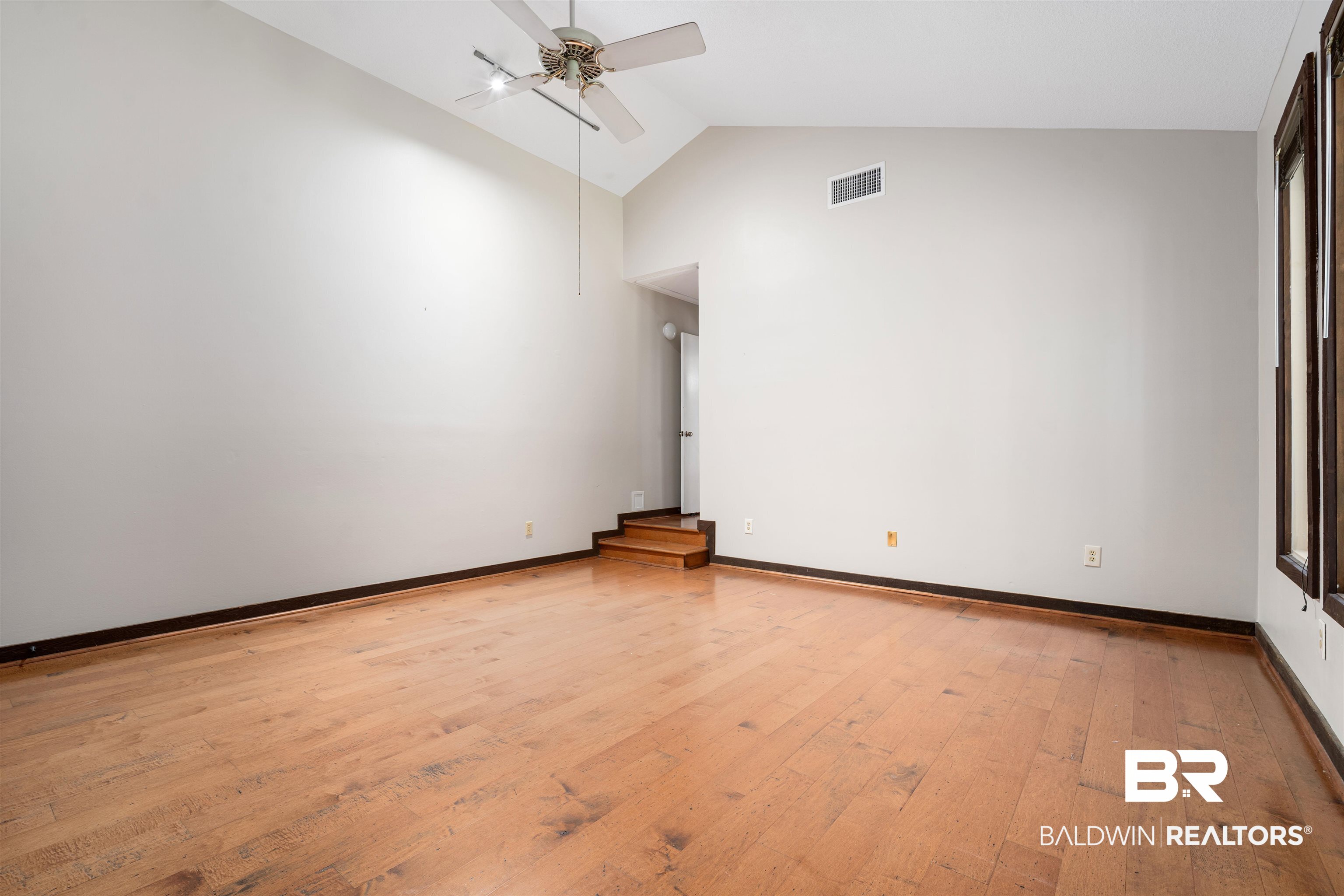 7912 Yorkhaven Road Mobile, AL 36695 - Photo 18 of 41 Unfurnished room featuring ceiling fan, light wood finished floors, and high vaulted ceiling