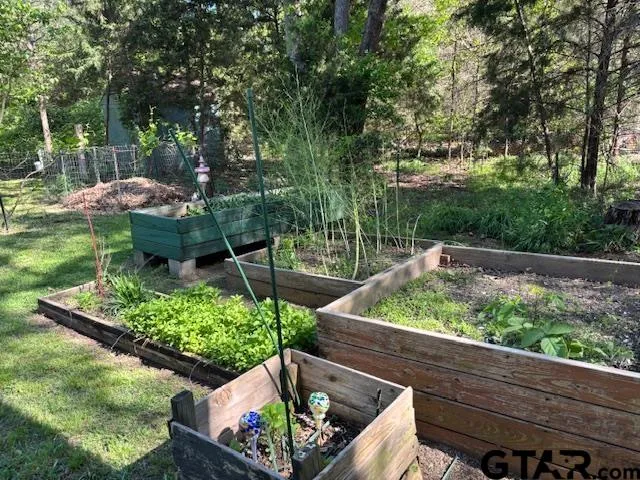 a view of a garden with a patio