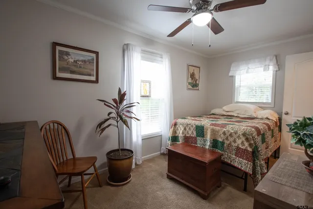 a bedroom with a bed and window