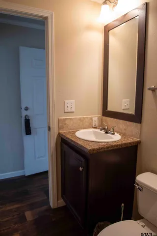 a bathroom with a sink and a mirror