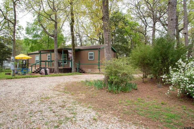 a house with trees in front of it
