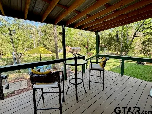 a view of a two chairs in the balcony