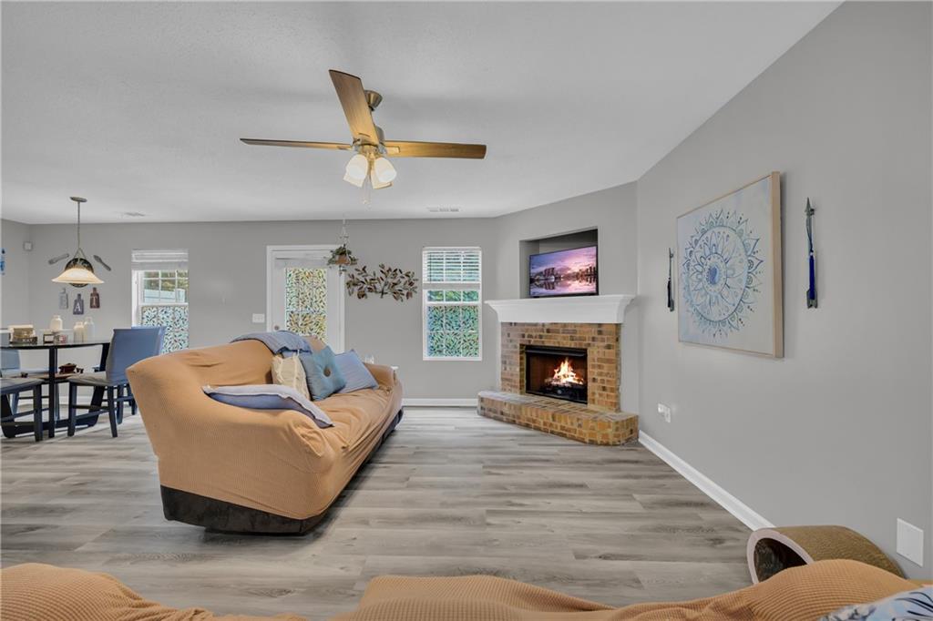 1498 Box Circle Winder, GA 30680 - Photo 16 of 56 a living room with furniture and a fireplace