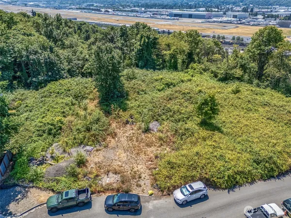 an aerial view of a city with mountains
