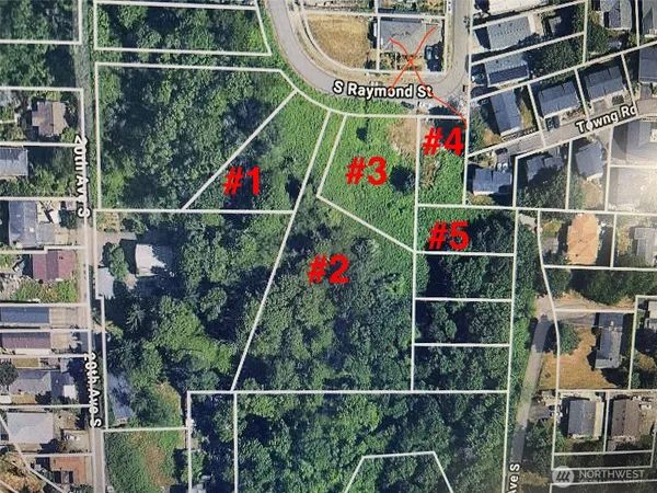 an aerial view of residential houses with outdoor space and trees