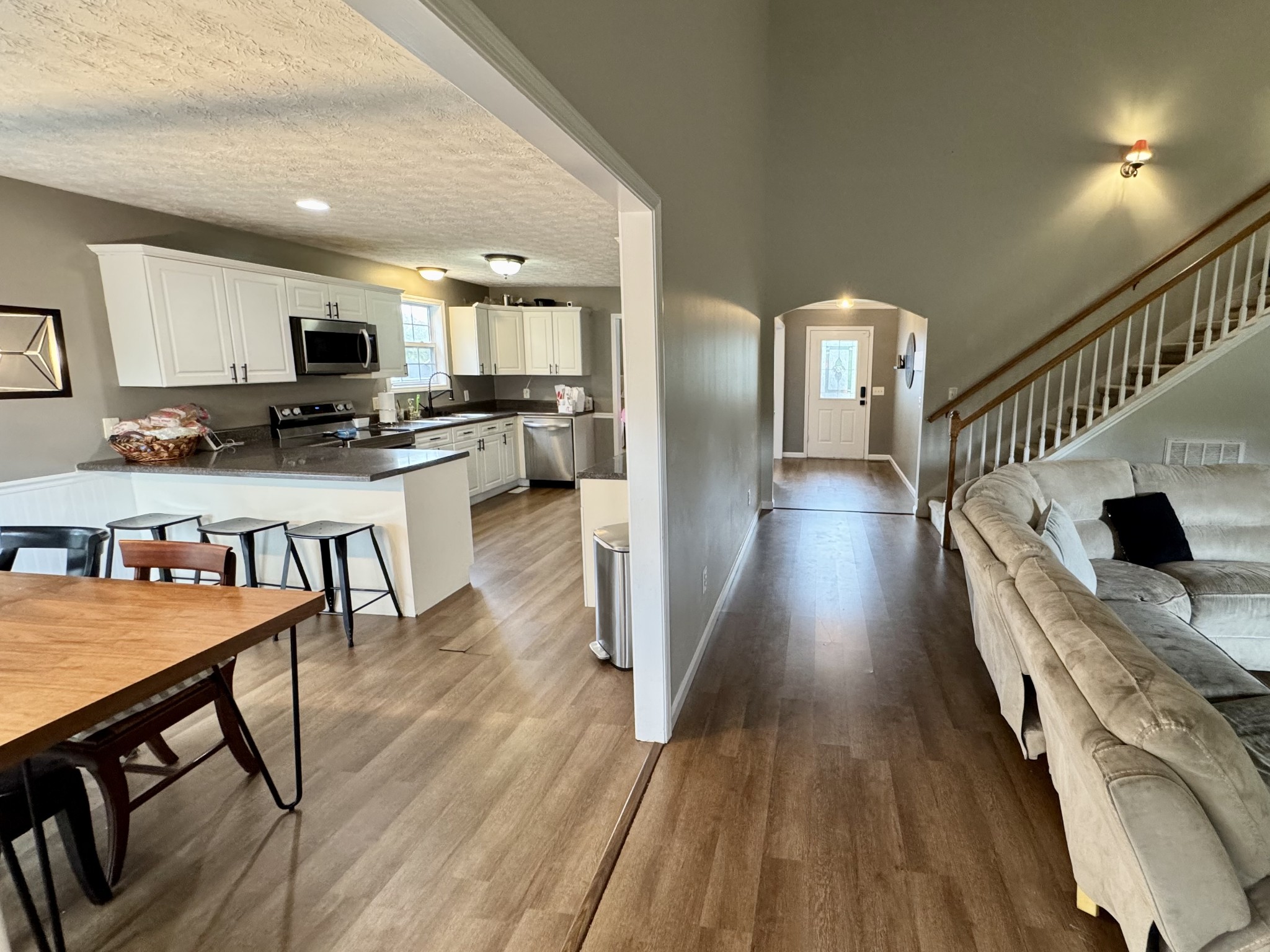 520 Briarhill Road Lebanon, TN 37087 - Photo 12 of 37 a dining hall with wooden floor and a view of kitchen