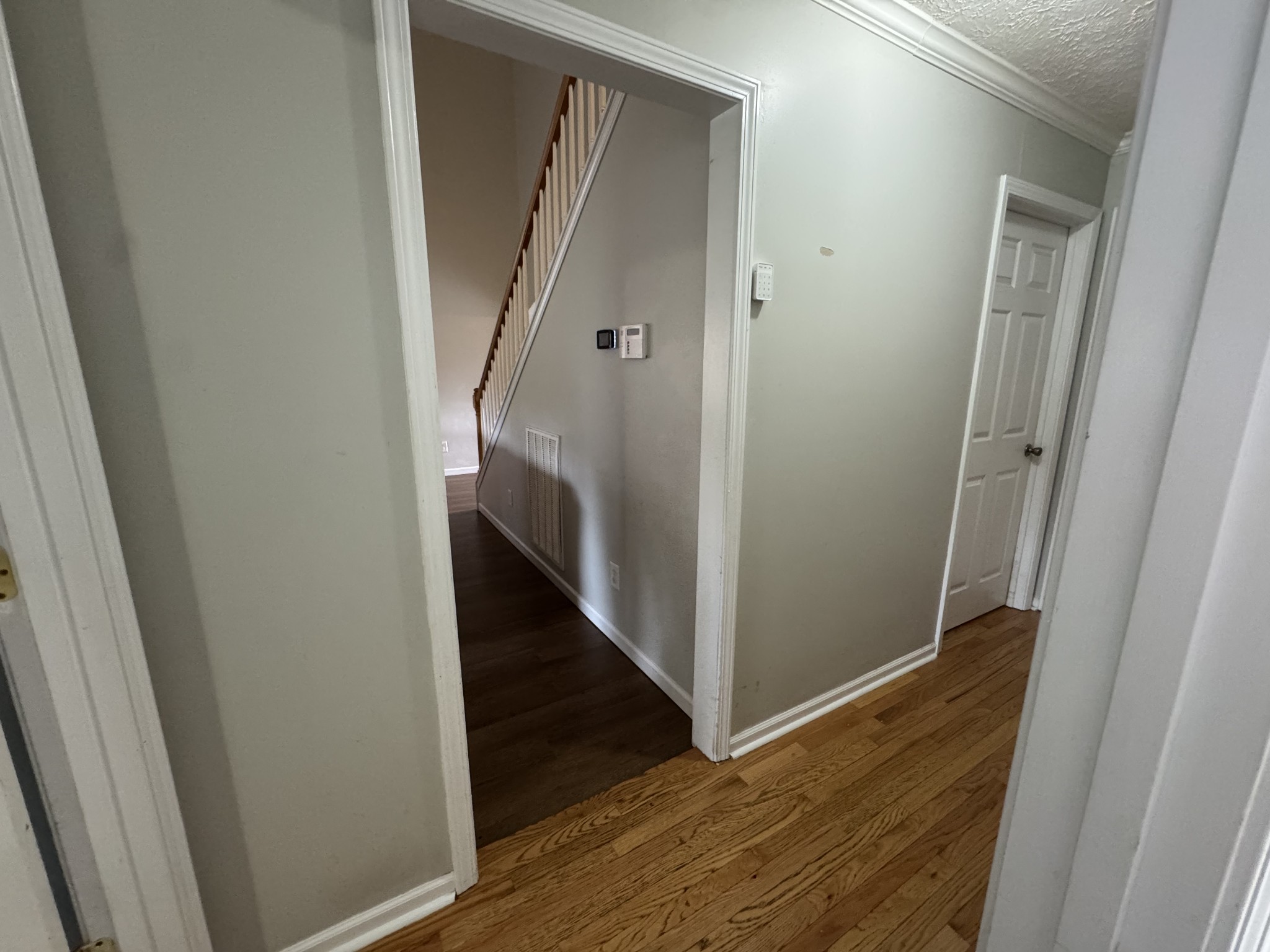520 Briarhill Road Lebanon, TN 37087 - Photo 16 of 37 a view of a hallway with wooden floor and staircase