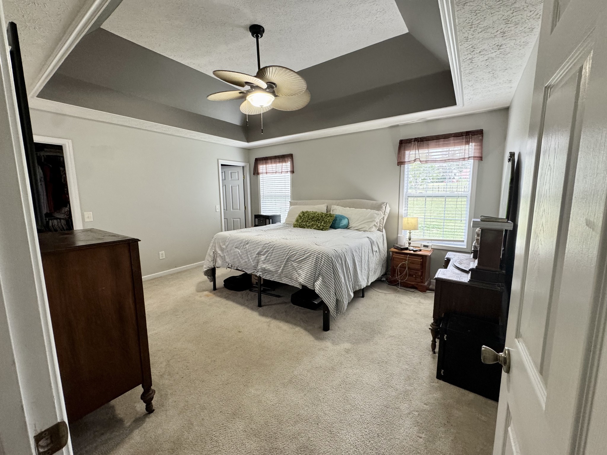 520 Briarhill Road Lebanon, TN 37087 - Photo 20 of 37 a spacious bedroom with a bed and a flat screen tv