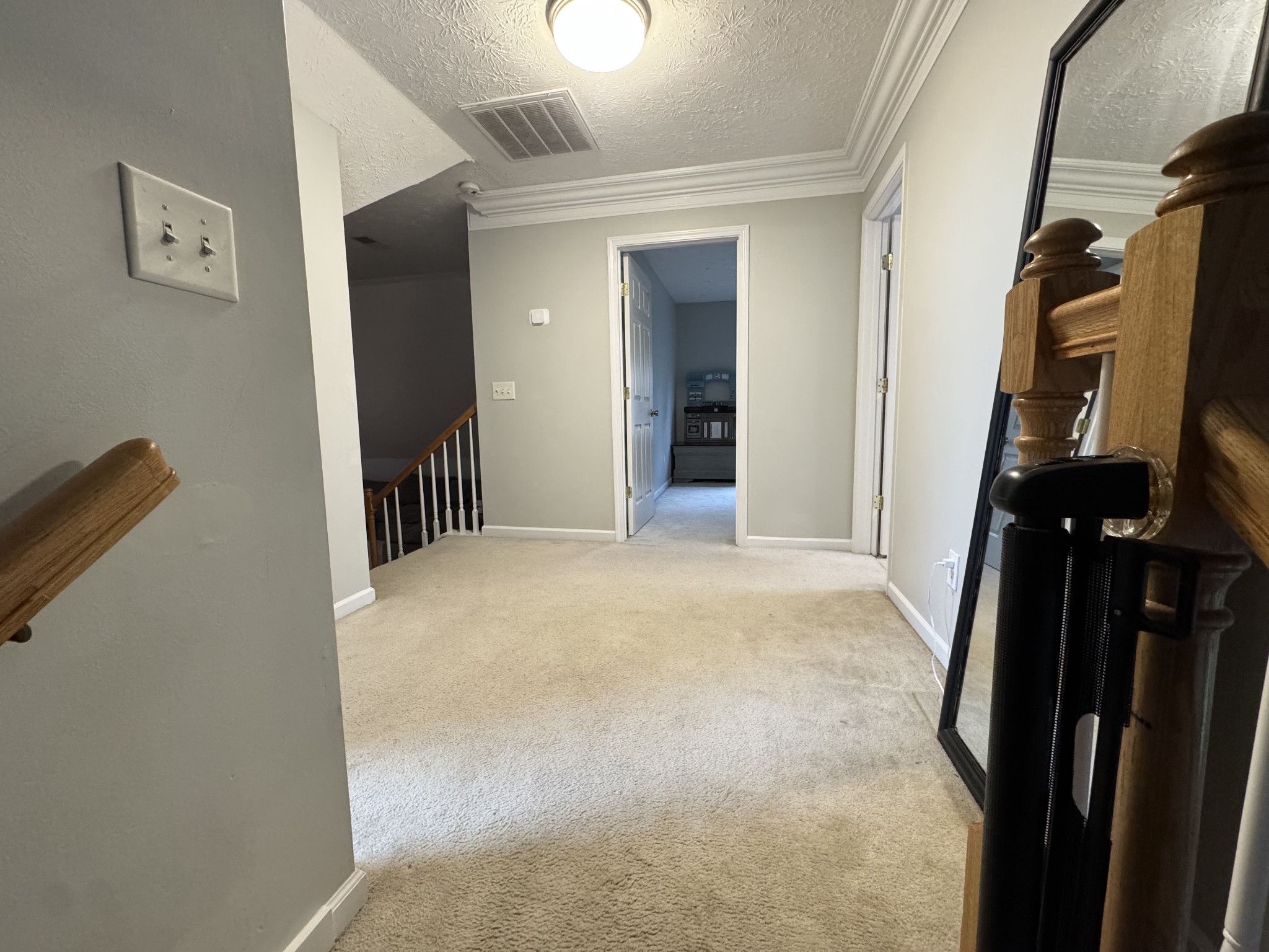 520 Briarhill Road Lebanon, TN 37087 - Photo 25 of 37 a view of a hallway with wooden floor and stairs