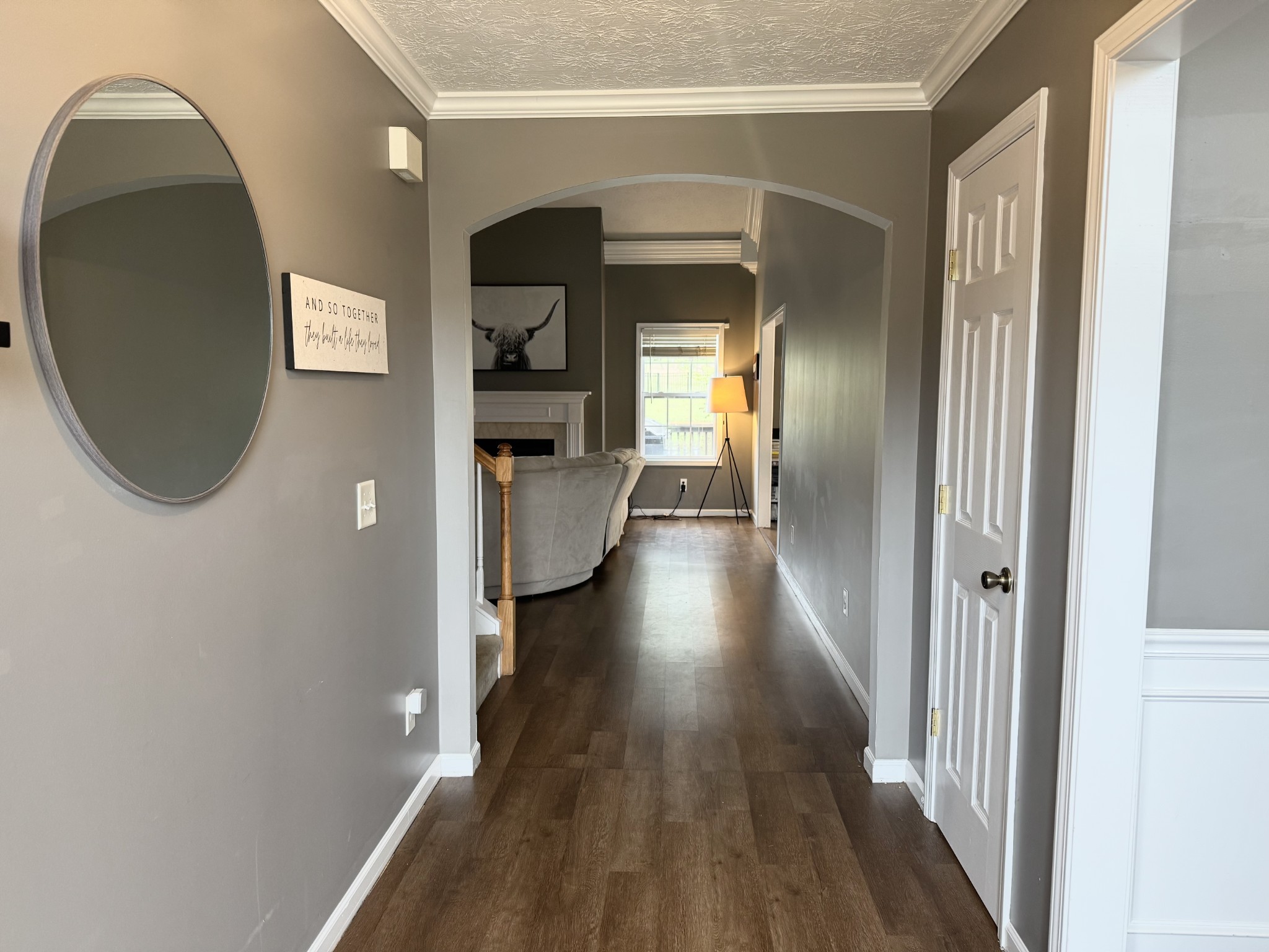 520 Briarhill Road Lebanon, TN 37087 - Photo 3 of 37 a view of a hallway with wooden floor and a living room