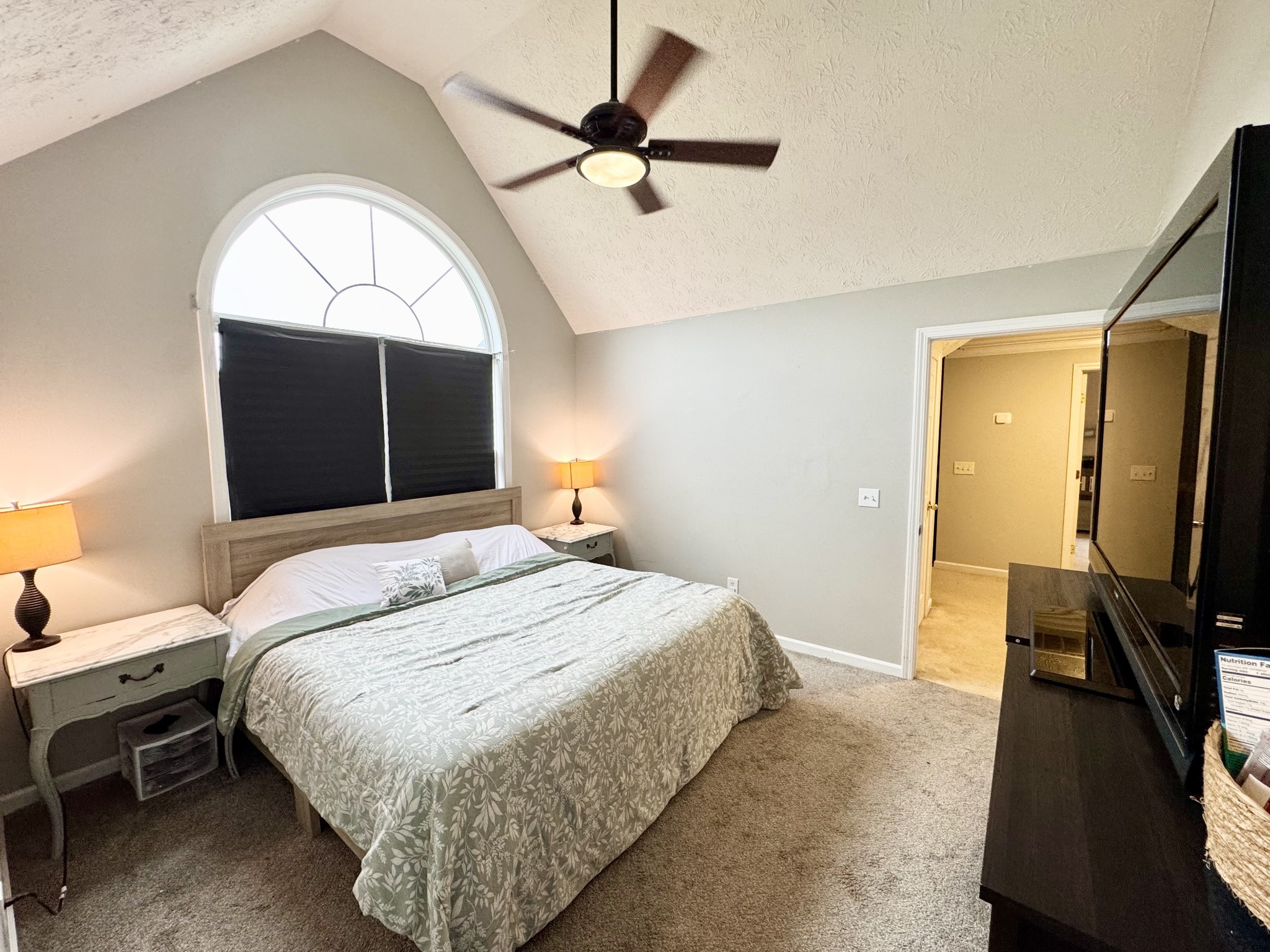 520 Briarhill Road Lebanon, TN 37087 - Photo 33 of 37 a bedroom with a bed and a chandelier