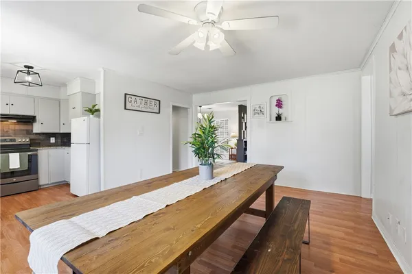 a kitchen with stainless steel appliances granite countertop white cabinets a sink and dishwasher