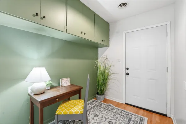 a view of a dining room with furniture and chandelier