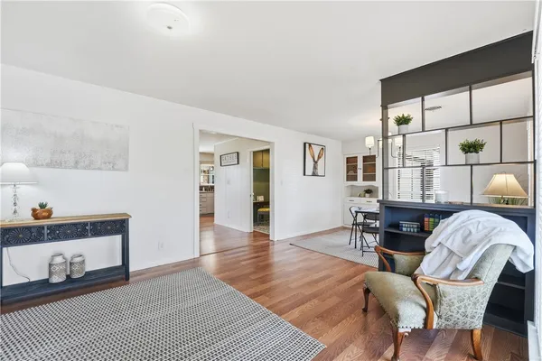 a bedroom with furniture and a window