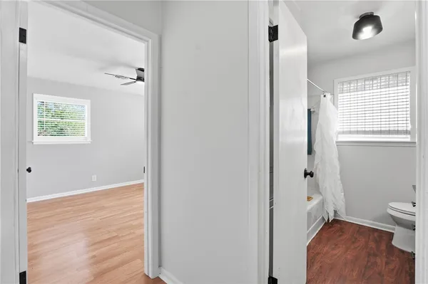 a view of a livingroom with furniture and wooden floor