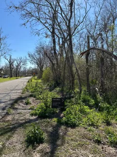 a backyard of a house with a yard and outdoor seating