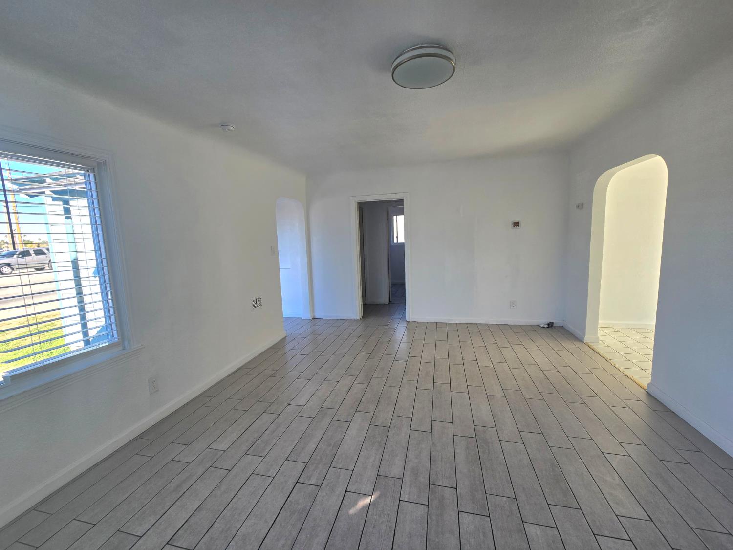 320 North Sanborn Road Salinas, CA 93905 - Photo 8 of 26 a view of a room with wooden floor and a window