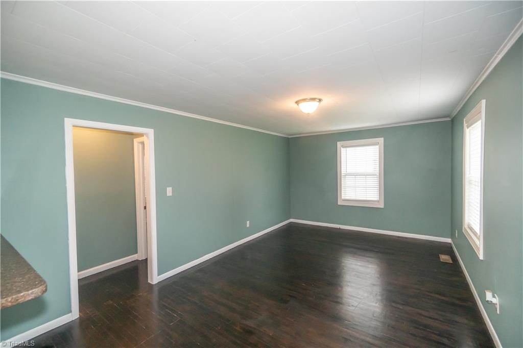 1500 Valley Ridge Drive High Point, NC 27260 - Photo 12 of 27 Living room area with hardwood floors and vinyl windows.