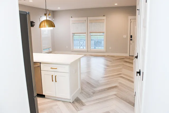 a bathroom with a sink a mirror and a shower