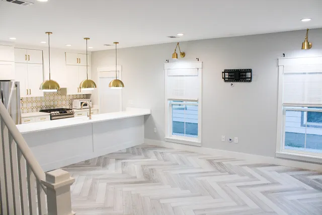 a view of kitchen with refrigerator and window