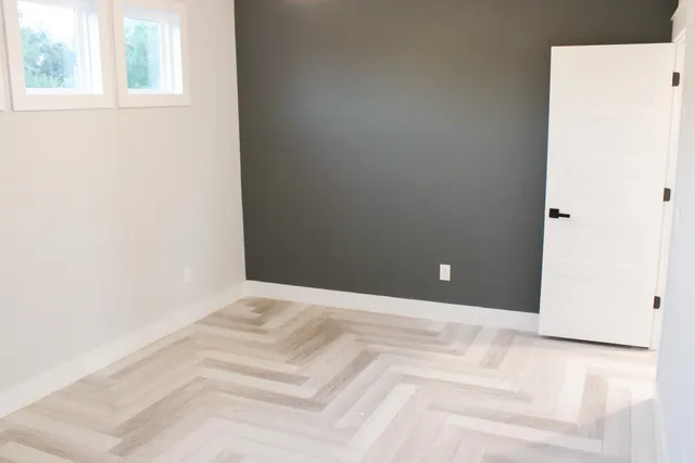 a view of a room with a white bed