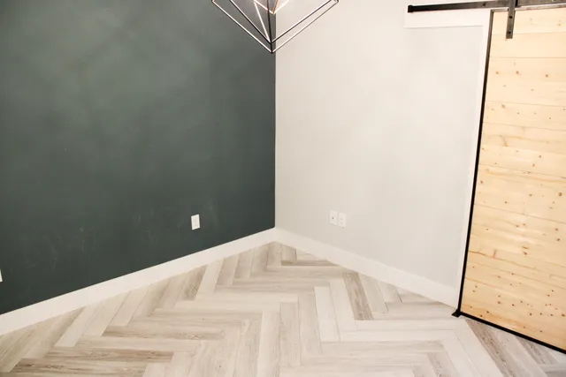 a white bed in a small room