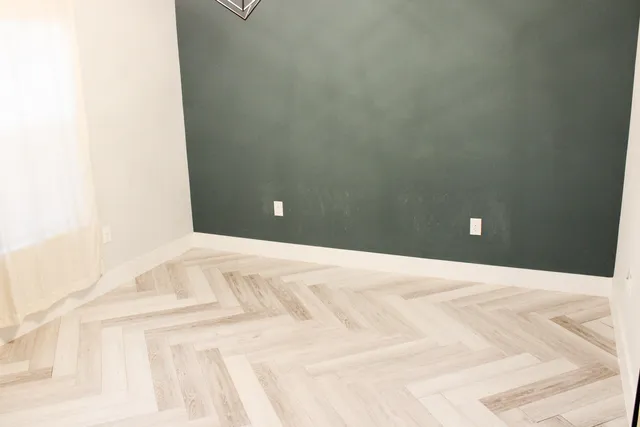 a view of a room with a white wall