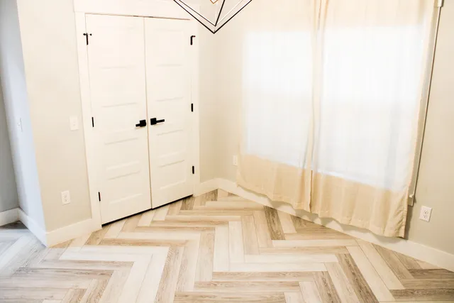 a view of a bedroom from a hallway